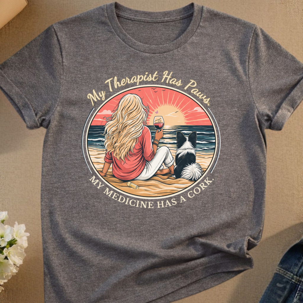 T-shirt graphic with dog and wine on beach with text "My Therapist Has Paws. My Medicine Has A Cork."