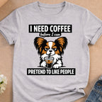 Dog in t-shirt with "I need coffee before I can pretend to like people" text.