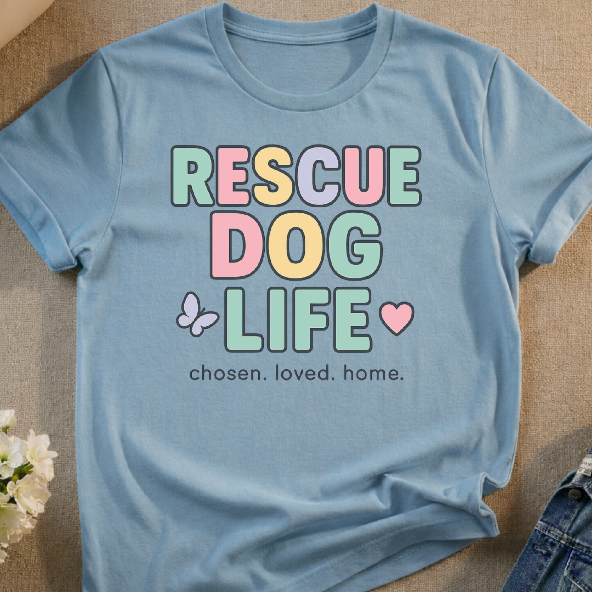 Light blue t-shirt with "RESCUE DOG LIFE" text and heart graphics.