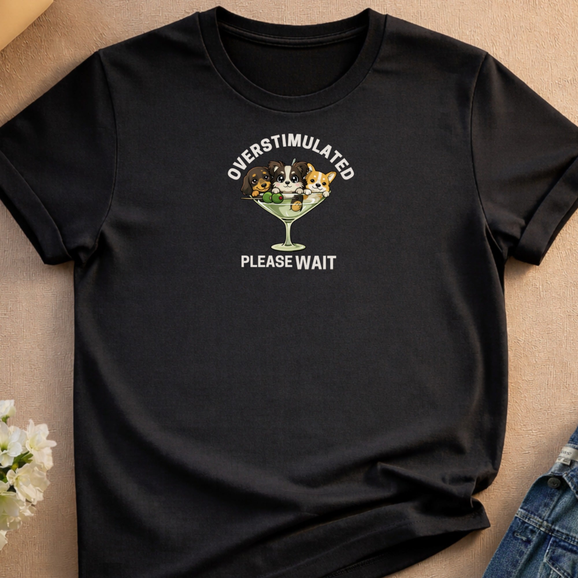 Black t-shirt with "Overstimulated Please Wait" text and three dogs in a martini glass.
