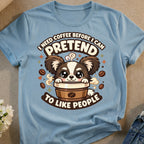 Cute cartoon dog in coffee cup saying "I need coffee before I can pretend to like people."