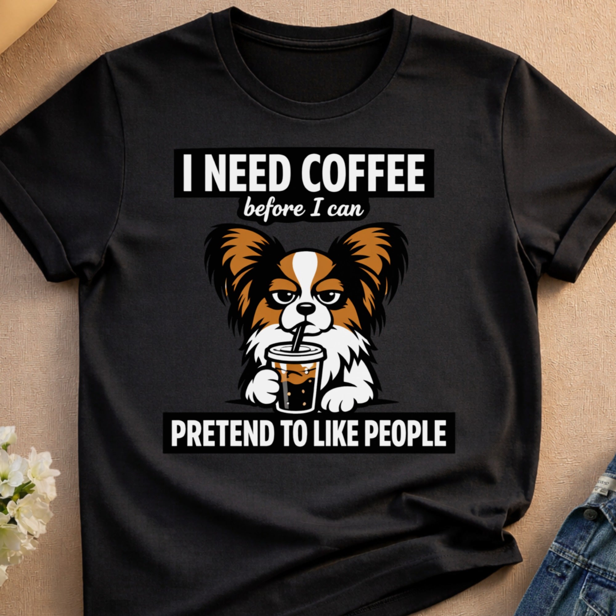 Black t-shirt with white text reading "I need coffee before I can pretend to like people" and a cartoon dog.
