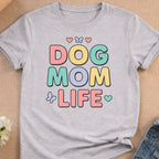 Gray t-shirt with pastel text "DOG MOM LIFE" and small heart and butterfly accents.