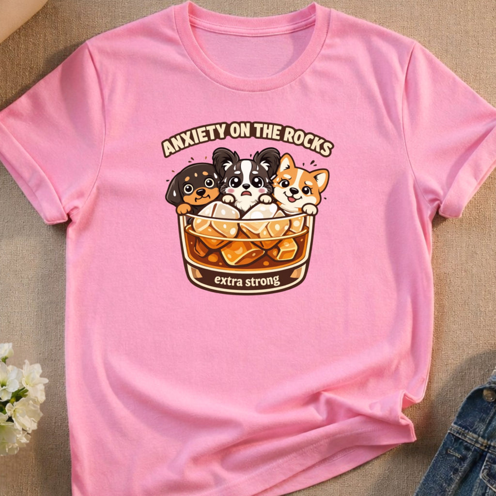 Pink t-shirt with cartoon dogs in a drink labeled "Anxiety on the Rocks extra strong".