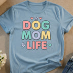 Light blue t-shirt with "DOG MOM LIFE" in colorful, block letters.