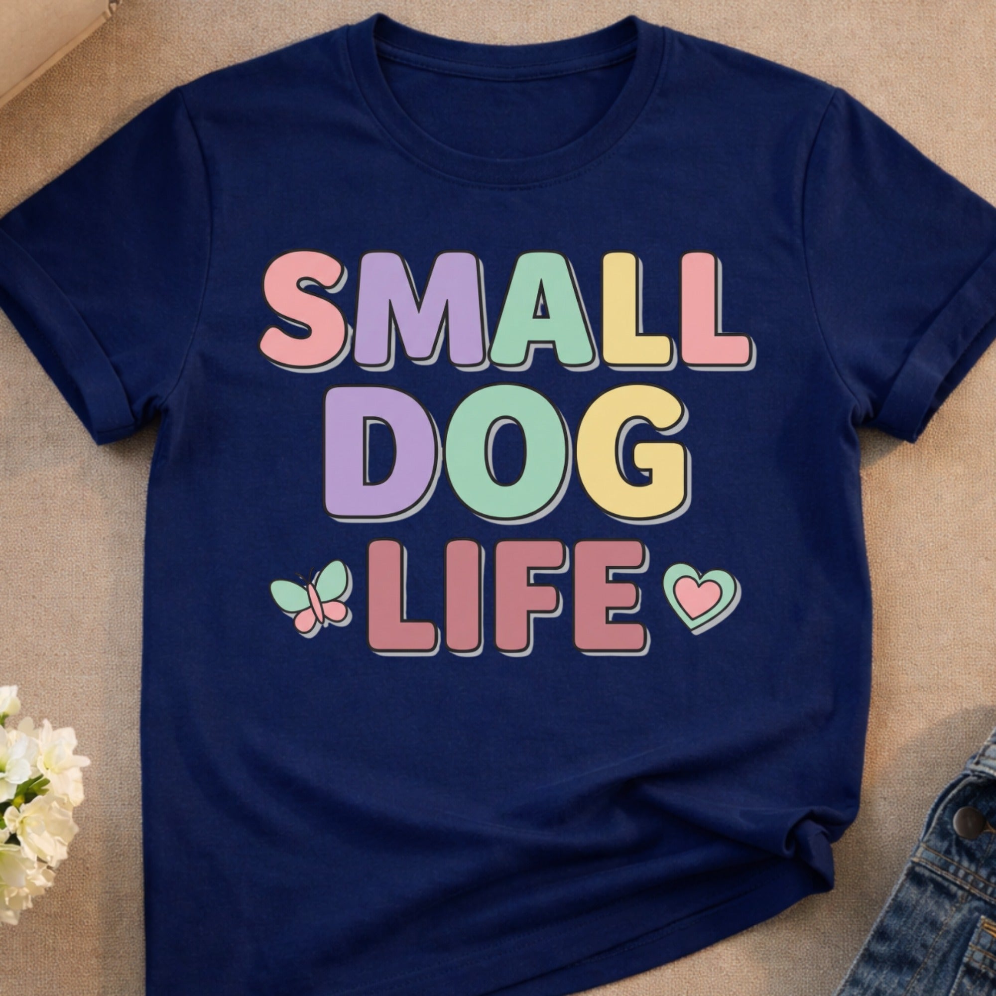 Navy t-shirt with "SMALL DOG LIFE" in pastel block letters and butterfly accents.