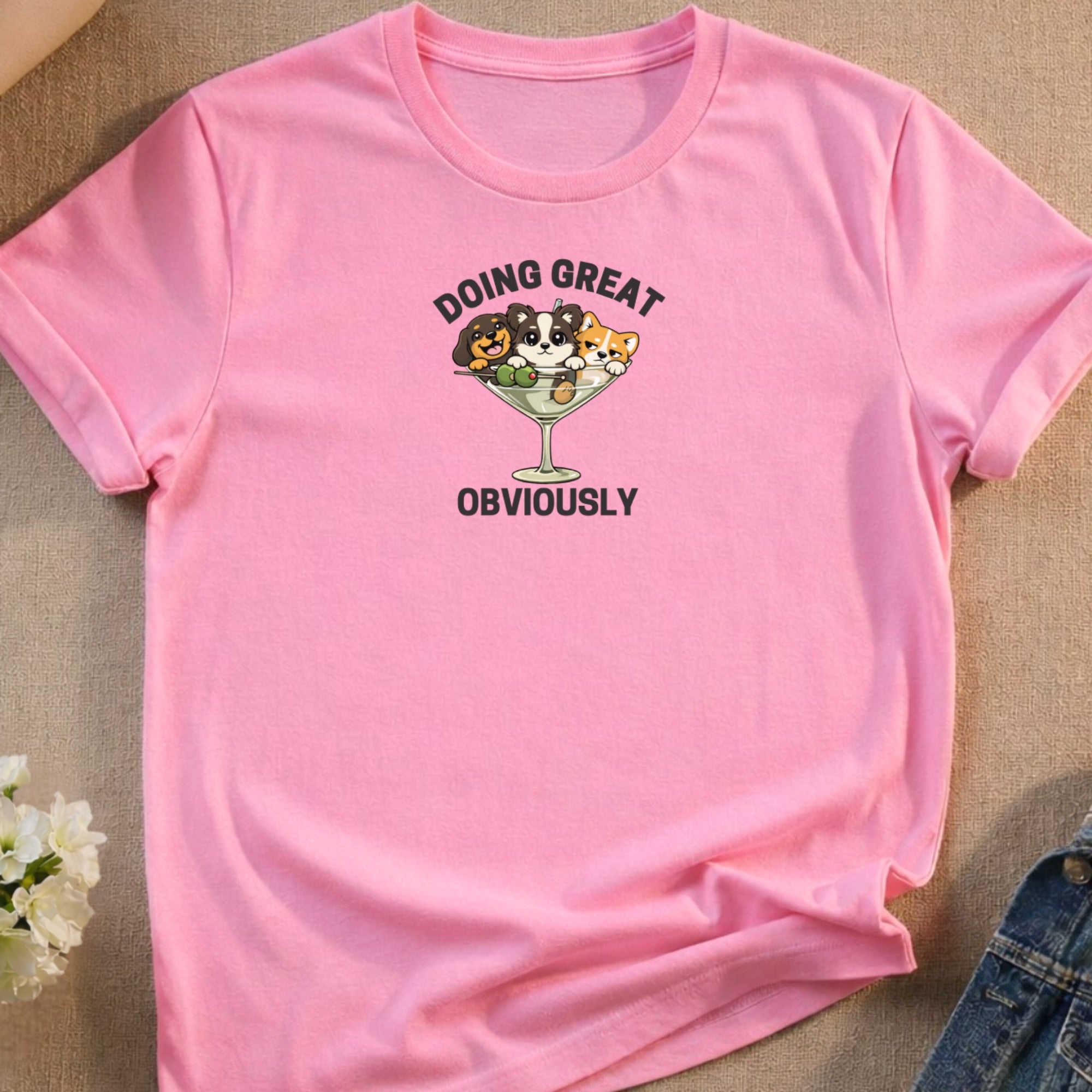 Pink t-shirt with cartoon dogs in a martini glass saying "DOING GREAT OBVIOUSLY".