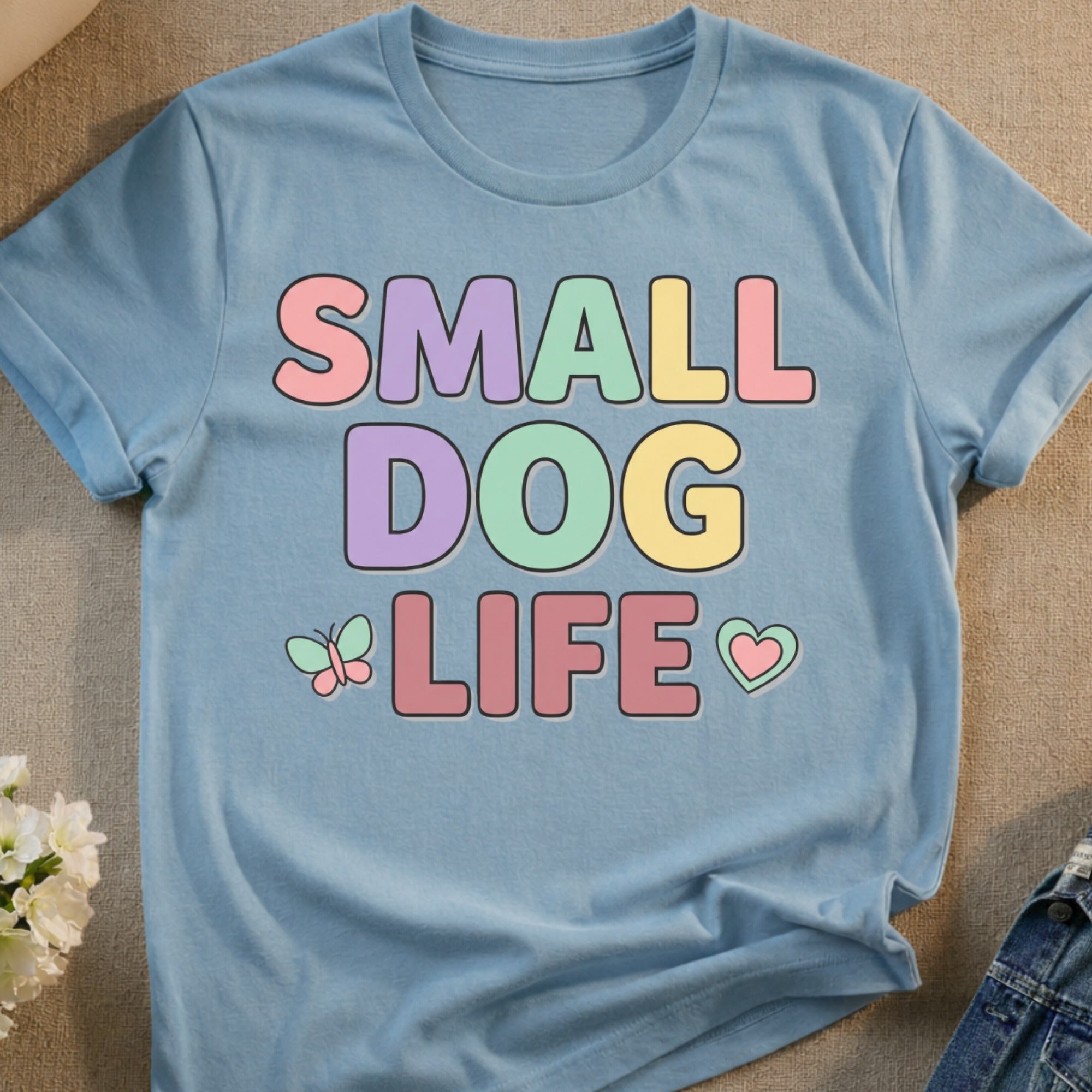 Light blue t-shirt with pastel "SMALL DOG LIFE" text and butterfly.