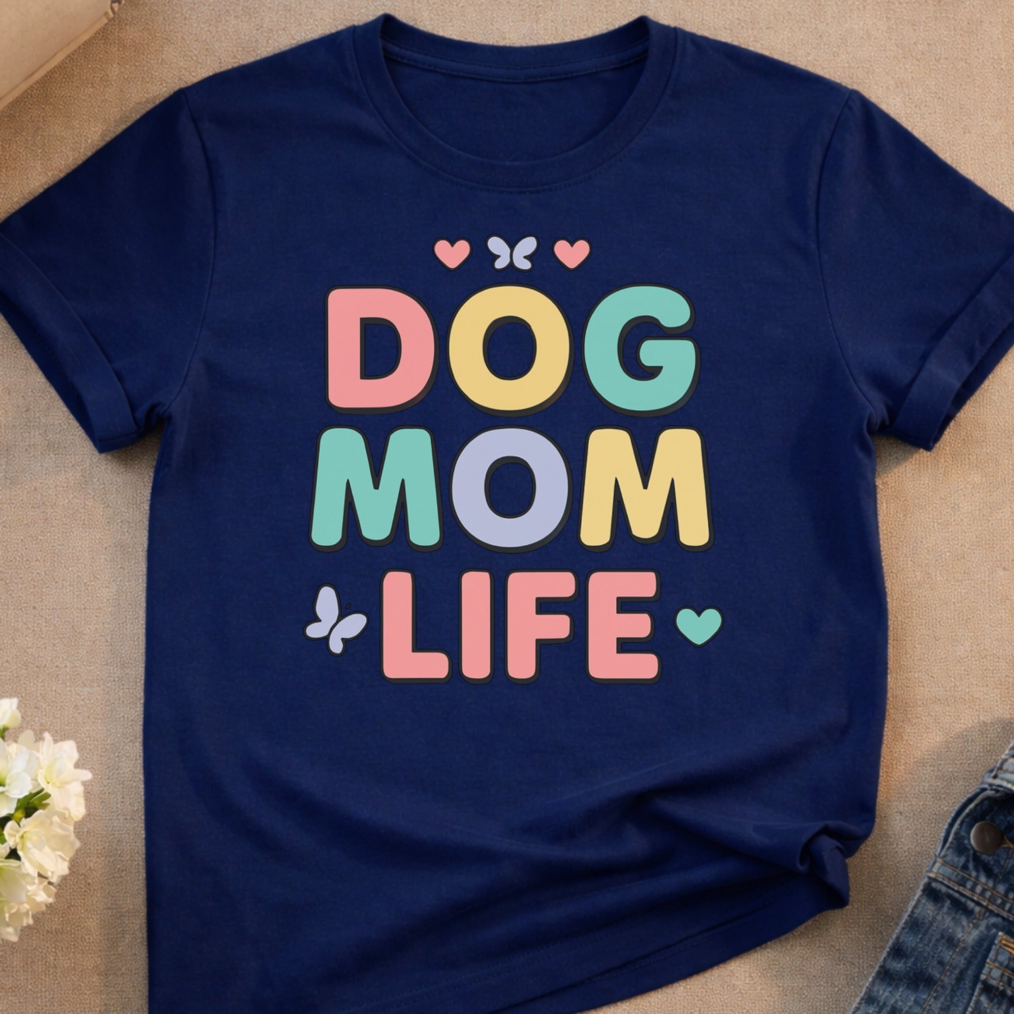 Navy t-shirt with "DOG MOM LIFE" text and small heart and butterfly graphics.