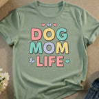 Sage green t-shirt with "DOG MOM LIFE" in colorful block letters.