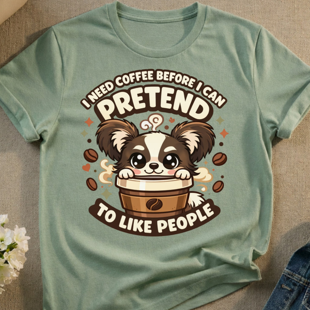 Green t-shirt with cartoon dog in coffee cup saying "I need coffee before I can pretend to like people".