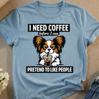 Dog wearing glasses, drinking coffee, with "I need coffee before I can pretend to like people" text.