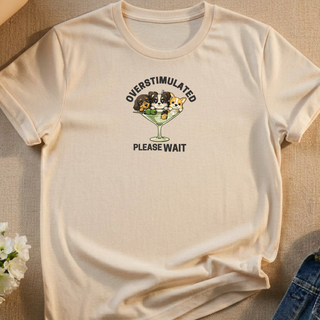 T-shirt with three cartoon puppies in a martini glass, reading "OVERSTIMULATED PLEASE WAIT".