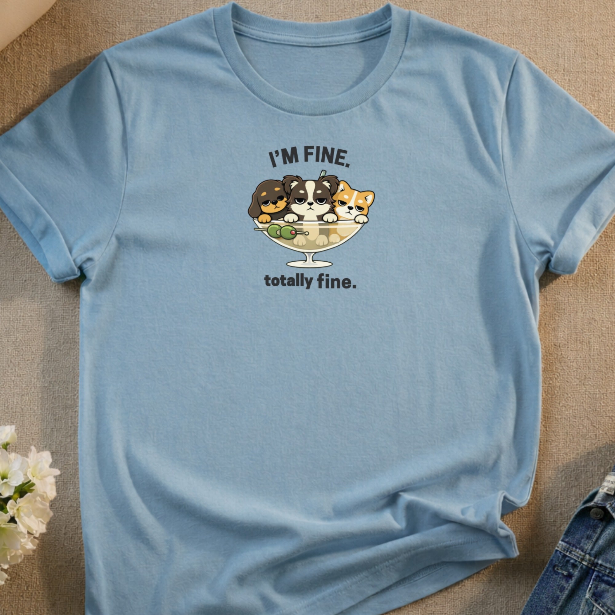Light blue t-shirt with cartoon puppies in a bowl and "I'M FINE. totally fine." text.