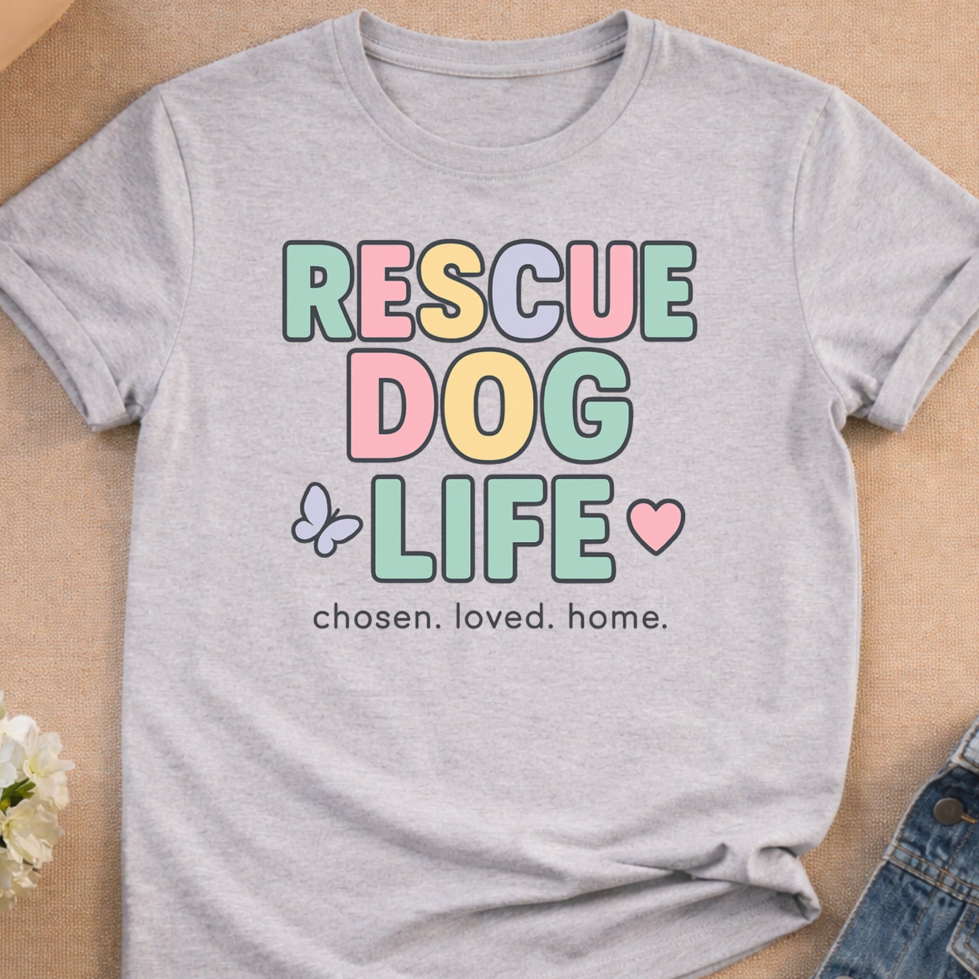Light grey t-shirt with "RESCUE DOG LIFE" and heart/butterfly graphics.