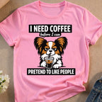 Pink t-shirt with text "I need coffee before I can pretend to like people" and dog.